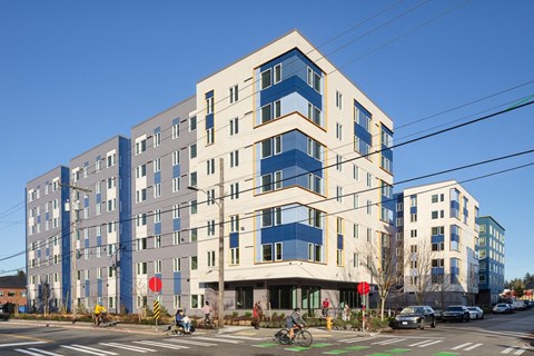 a large building on the corner of a city street